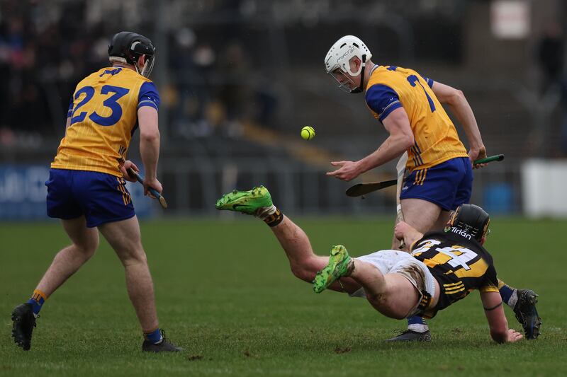 Matty Taylor of Clare in action against Gearoid Dunne of Kilkenny. Photograph: Natasha Barton/Inpho