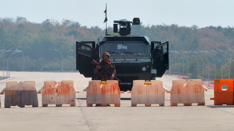 A soldier stands guard on a blockaded road to Myanmar’s parliament  after the military detained the country’s de facto leader Aung San Suu Kyi and the country’s president in a coup. Photograph: STR/AFP/Getty Images.