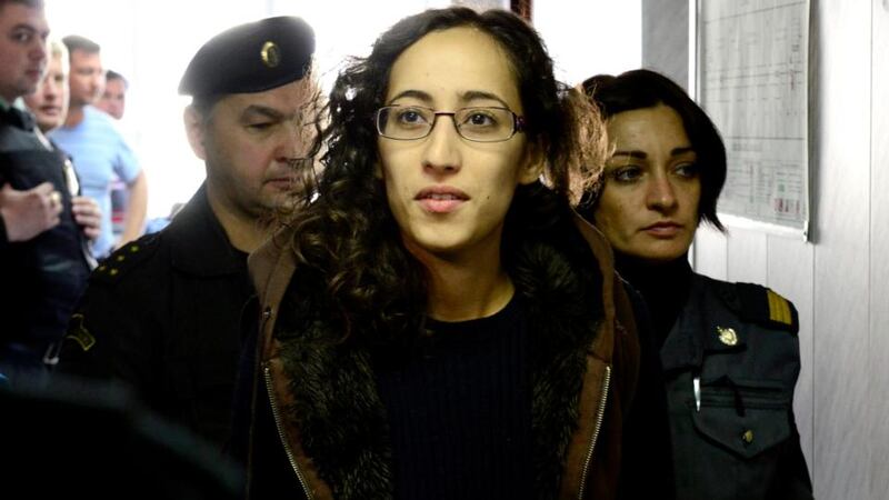 Greenpeace activist Faiza Oulahsen from the Netherlands  is escorted at a district court in Murmansk. Photograph: Stringer/Reuters