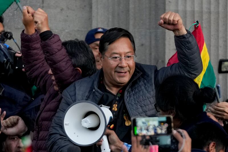 Bolivian president Luis Arce celebrates with supporters following the failure of the attempted coup. Photograph: Juan Karita/AP