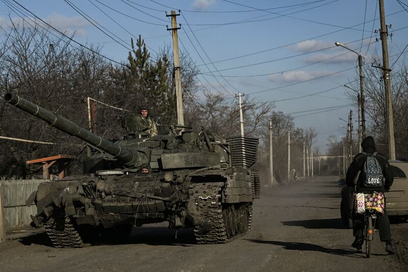 Ukrainian servicemen drive a tank in the village of Chasiv Yar, near the city of Bakhmut in the Donbas region. Photograph: Aris Messinis/AFP/Getty