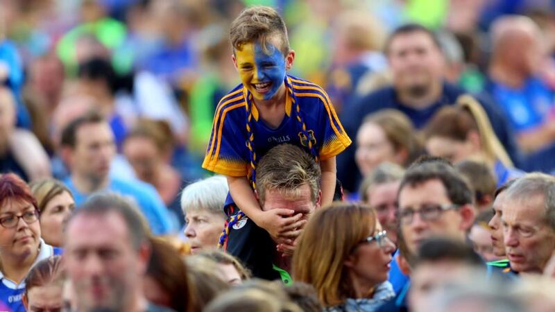 A boy in the crowd enjoys the homecoming as GAA All-Ireland hurling champions Tipperary appear at  Semple Stadium, Thurles. Photograph: James Crombie/Inpho