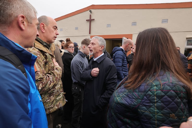 Roman Protsenko who served in the Ukrainian Army and Larysa Gerasko Ukraininan Ambassador to Ireland (Right) paying their respects to John Deegan, (centre) father of Robert Deegan. Photograph: Alan Betson



