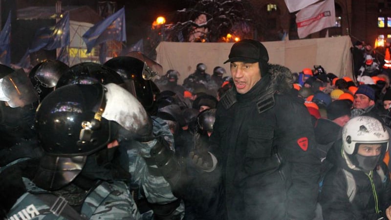 UDAR (Ukrainian Democratic Alliance for Reform) party leader Vitaly Klitschko (right) takes part in a pro-European integration protest in Independence Square in Kiev early this morning. Photograph: Valentyn Ogirenko/Reuters.