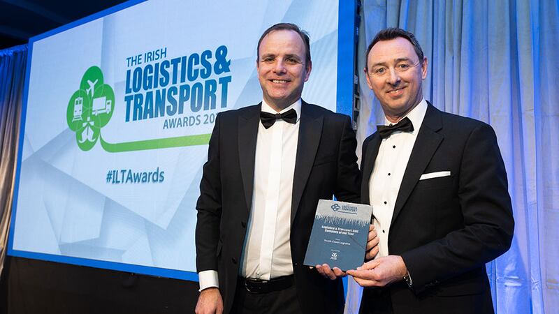 Martin Kelly, Associate Director, AIB Corporate, present the Logistics & Transport SME Company of the Year award to Richie O'Flynn, South Coast Logistics.