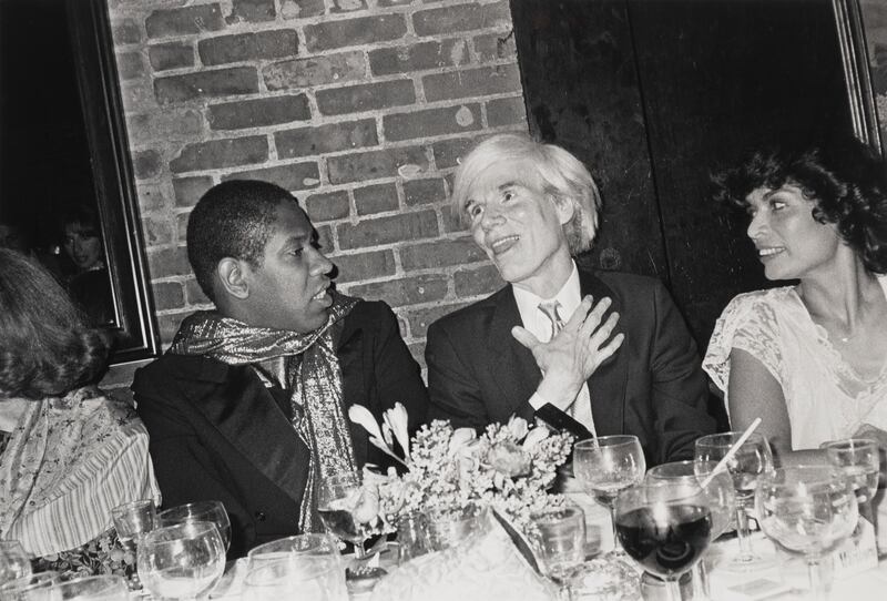 André Leon Talley, Andy Warhol and Bianca Jagger at her birthday dinner, Mortimers, 1981