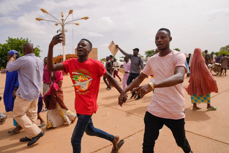 Supporters of Niger’s ruling junta cheer in Niamey. Photograph: AP