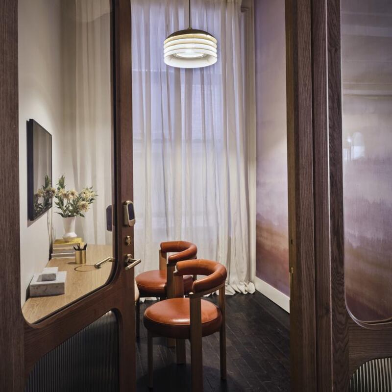 The Malin’s Zoom room with calico wallpaper and Arne Jacobsen vintage light. Photograph: Thomas Loof