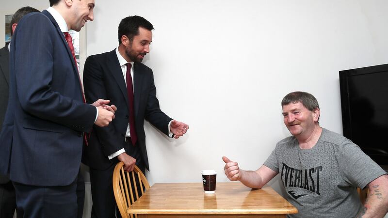 Joe Shannon welcomes the ministerial duo to his home. Photograph: Brian Lawless/PA