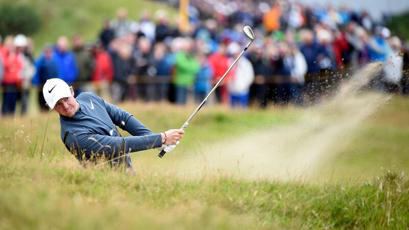 Rory McIlroy blasts out of a bunker during the second round of the British Open at Royal Birkdale. Photograph:  EPA