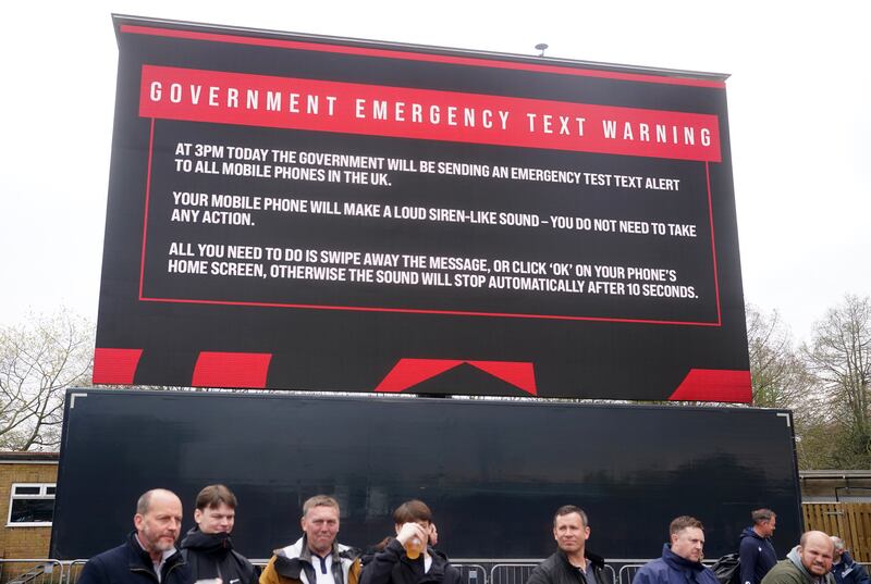 A government emergency text warning sign outside the stadium ahead of the football match in London. Photograph: Adam Davy/PA