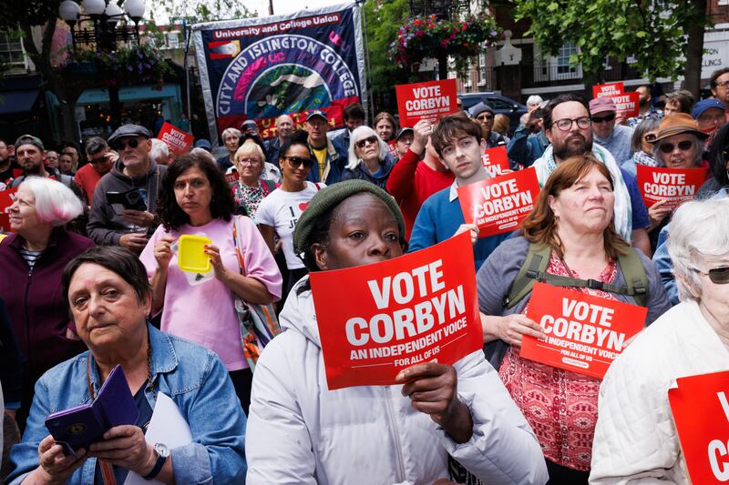 Supporters listen to Jeremy Corbyn talk in London this month. Photograph: Dan Kitwood/Getty Images