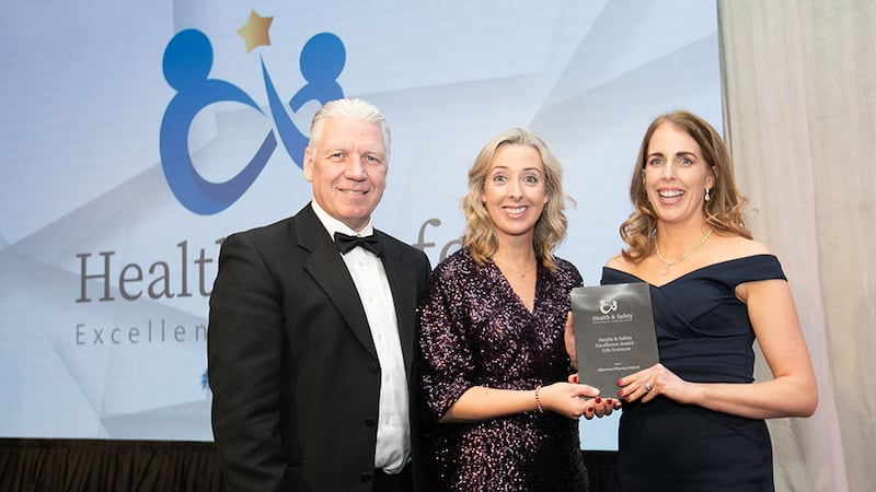 Eric Doyle, managing director at ISS Facility Services Ireland, presents the Health & Safety Excellence Award - Life Sciences award to Monica Doyle and Patricia McDonnell, Alkermes Pharma Ireland