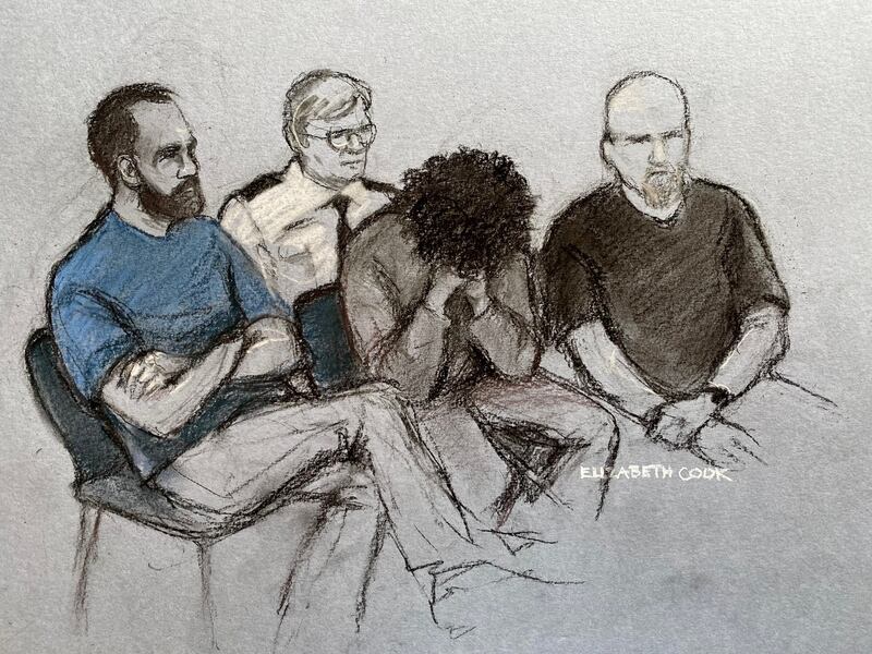 A court artist's drawing of Axel Rudakubana (centre) covering his face as he appeared in the dock at Liverpool Crown Court. Image: Elizabeth Cook /PA Wire