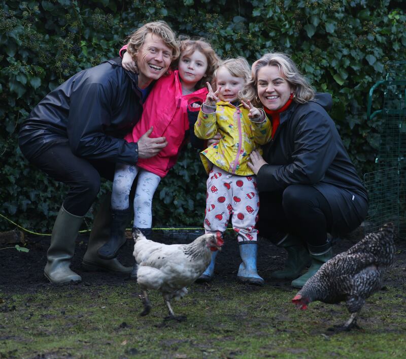 Justin Howlett and Rachel Flynn with their children, Bódhan (3) and Nell (7), and their hens at their home on the South Circular Road Dublin. Photograph: Bryan O’Brien