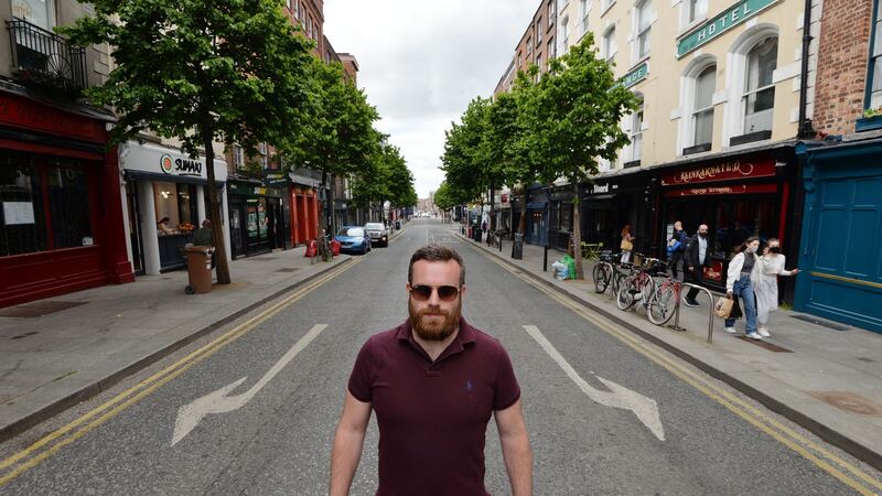 Paul Keville from Stoned Pizza on Dublin’s Parliament Street is one of the businessmen   lobbying for  wider footpaths and restrictions on traffic. Photograph: Alan Betson