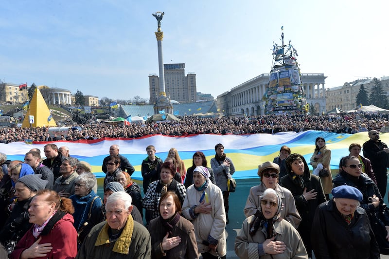 Protesters hold a giant Ukrainian and Crimean flag during a rally on Independence Square in Kiev on March 23rd, 2014. Photograph: Sergei Supinsky/AFP via Getty