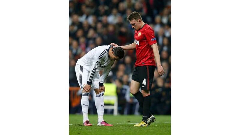 Real Madrid's Cristiano Ronaldo and Manchester United's Phil Jones during the 1-1 draw at the Bernabeu. Photograph: Susana Vera/Reuters