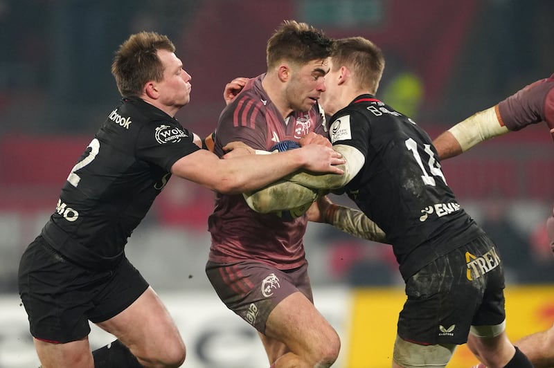 Munster's Jack Crowley is tackled by Saracens' Nick Tompkins. Photograph: Brian Lawless/PA