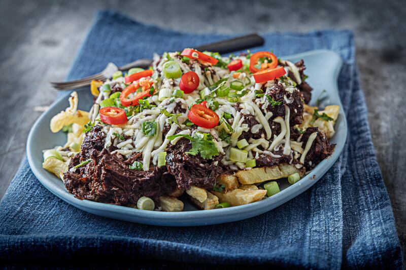 Ultimate loaded fries with braised beef short rib chilli, spring onions and cheese