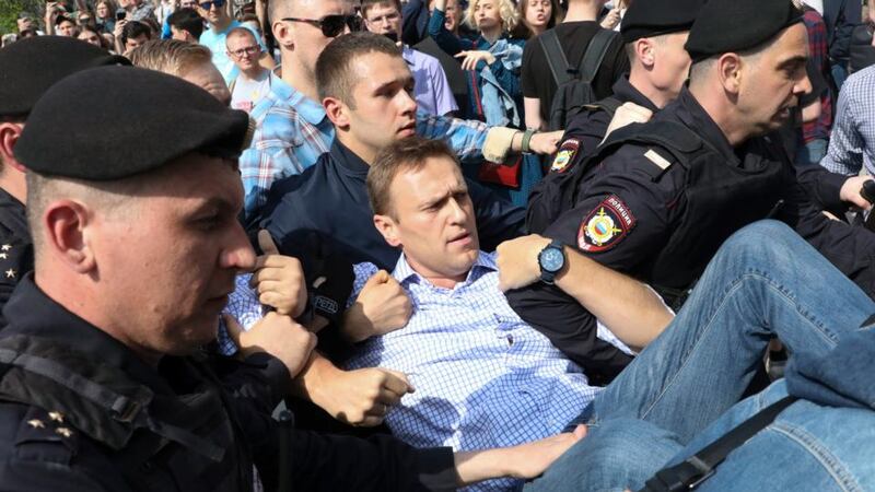 Putin opponent Alexei Navalny is carried away by police at a demonstration against the Russian president in Pushkin Square in Moscow, Russia. Photograph: AP Photo