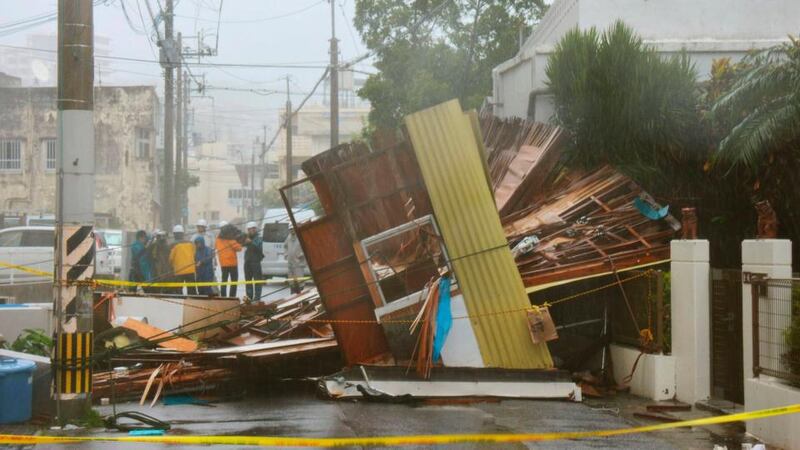 A wooden house which collapsed due to strong winds caused by Typhoon Neoguri is seen in Naha, on Japan’s southern island of Okinawa, in this photo taken by Kyodo today. Photograph: Kyodo/Reuters.