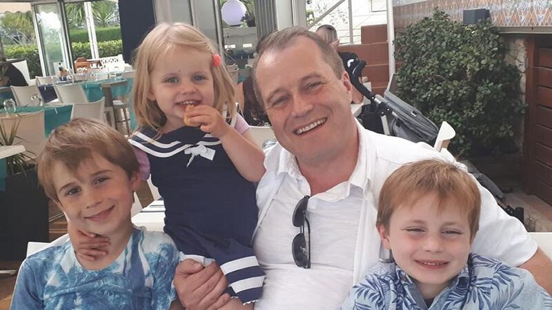 A family handout of Conor McGinley (9), Carla McGinley (3) and   Darragh McGinley (7) and with their father Andrew McGinley. The three children were found dead in a house in Parson’s Court, in Newcastle, Co Dublin on Friday night. Photograph: An Garda