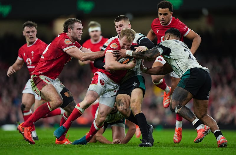 Wales' Blair Murray is tackled by Ireland's Sam Prendergast, Photograph: Joe Giddens/PA Wire