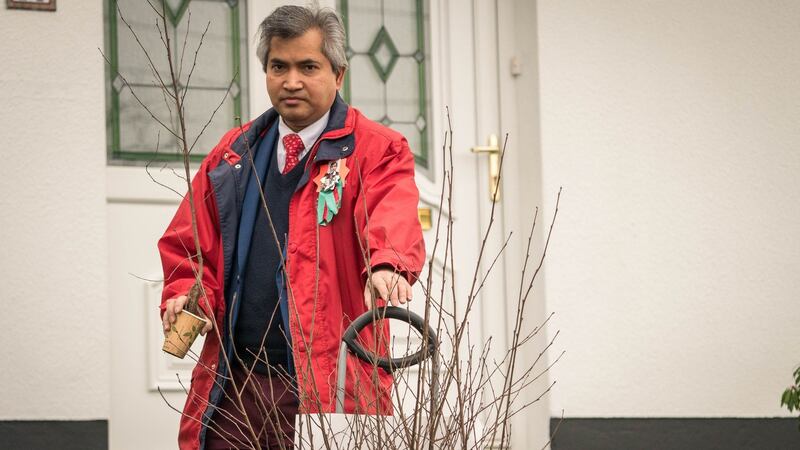 Labour Party General Election candidate Kamal Uddin with trees to give to people while canvassing in Castlebar, Co Mayo. Photograph: Keith Heneghan