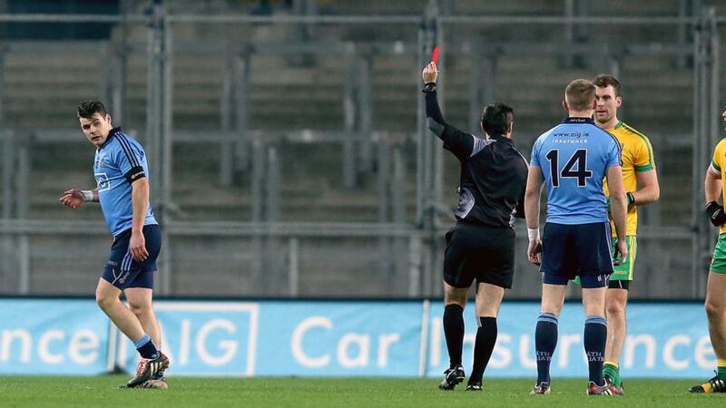 Dublin’s Kevin McManamon (left) leaves the field after being sent off against Donegal. Photograph: Donall Farmer / Inpho