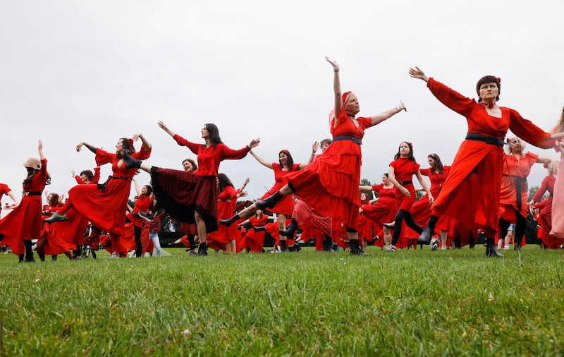 Participants in the Most Wuthering Heights Day Ever, an event held at locations around the world each July, where participants gather en masse to dress up as musician Kate Bush and learn and perform the dance routine from her 1978 song 'Wuthering Heights'. This year, Dublin marked the event in Fairview Park, raising money for Women's Aid.
Photograph: Alan Betson / The Irish Times

