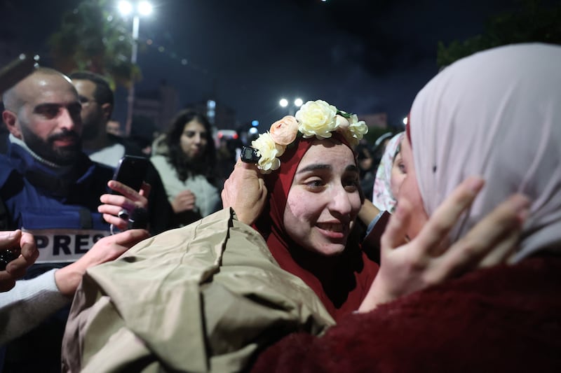 A Palestinian prisoner is welcomed by a relative upon the arrival of some 90 prisoners set free by Israel in the occupied West Bank town of Beitunia, on the outskirts of Ramallah. Photograph: Zain Jaafar/AFP/Getty