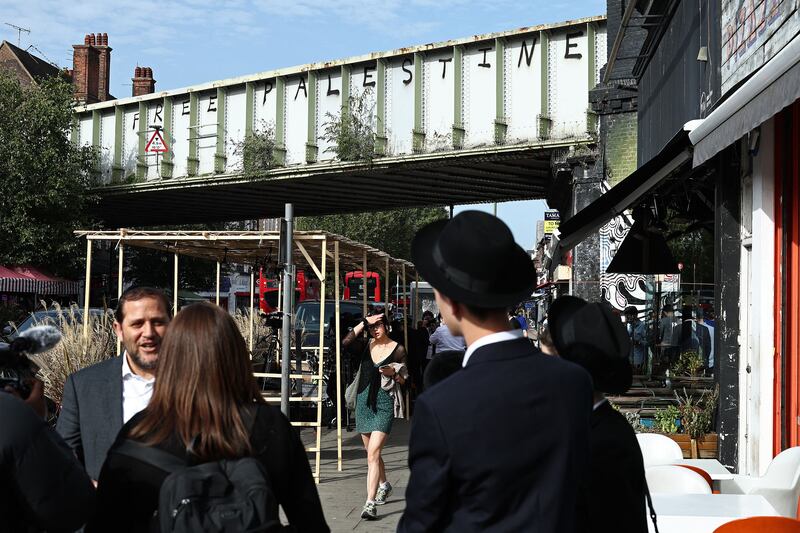 Graffiti reading 'Free Palestine'  on a railway bridge in Golders Green, north London. Photograph: Henry Nicholls/AFP via Getty Images