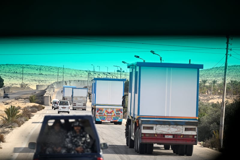 Egyptian soldiers accompany trucks carrying prefabricated houses along a road in Egypt's northern Sinai peninsula towards the border with the Gaza Strip, on January 19th, 2025, shortly after the Israel-Hamas ceasefire deal came into effect. Photograph: Khaled Desouki/AFP/Getty