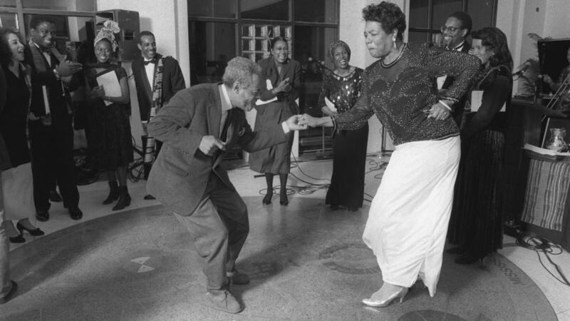 Amiri Baraka and Maya Angelou dance on the 89th birthday of the poet Langston Hughes at the The Schomburg Center for Research in Black Culture, where Hughes’ ashes were buried beneath the floor, in New York, in  1991. Photograph; Chester Higgins, Jr./The New York Times