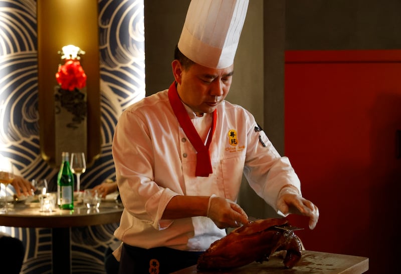 Chef Zhan Hua Yang carves duck at China Tang, Monkstown. Photograph: Nick Bradshaw