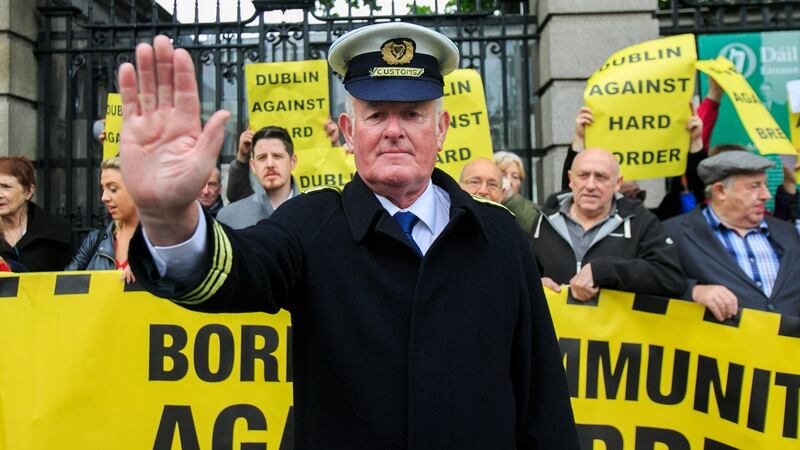 Protester Seamus McDonnell dressed as a Customs official during a rally outside Leinster House organised by Border Communities against Brexit over  Boris Johnson’s Brexit plans. Photograph: Collins