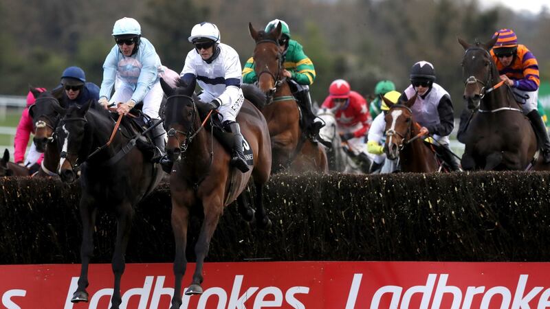 Foxy Jacks ridden by Jamie Moore (second left) goes on to win the Guinness Handicap Chase at the Punchestown Festival. Photograph: Brian Lawless/PA Wire