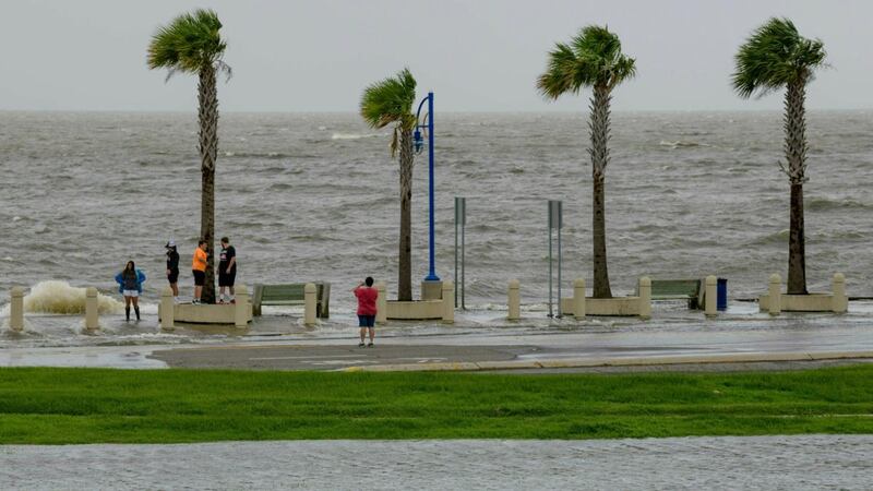 People check out the waves on Lakeshore Drive as water moves in from Lake Pontchartrain from the storm surge from Tropical Storm Barry in the Gulf of Mexico. Photograph: Matthew Hinton/AP Photo