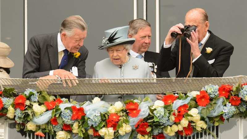 Queen Elizabeth II and the Duke of Edinburgh (right) during Derby Day at Epsom Downs Racecourse, Surrey.  Photograph: Dominic Lipinski/PA Wire