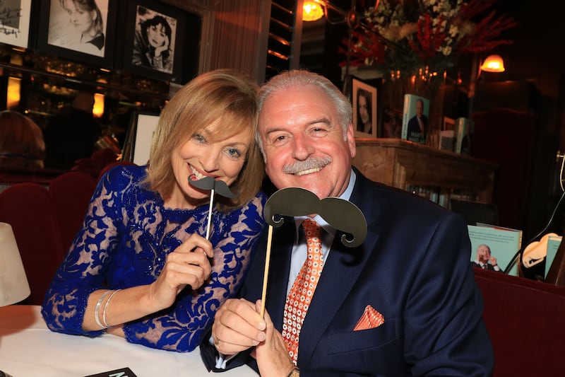 Comforting tickle: Broadcaster Mary Kennedy with Marty Whelan and comedy moustaches for the launch of his memoir, That's Life, in 2015. Photograph: Nick Bradshaw