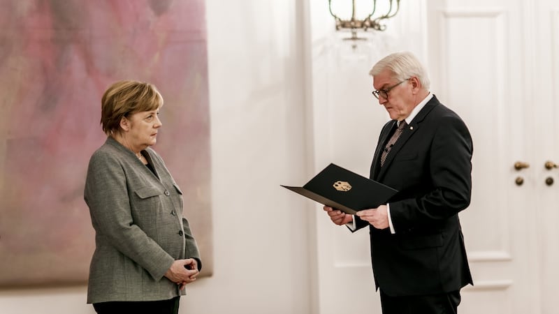 Angela Merkel with Frank-Walter Steinmeier, federal German president. Steinmeier has been heavily criticised by Ukraine’s ambassador over his ties to Russia. Photograph: Michael Gottschalk/Photothek via Getty Images