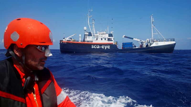 A crew member of the German NGO Sea-Eye migrant rescue ship Alan Kurdi takes part in a training exercise while on their way to the search and rescue zone  in the western Mediterranean Sea. Photograph: Reuters/Darrin Zammit Lupi