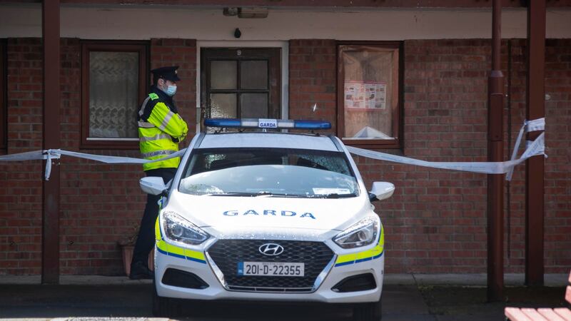 Gardaí at the apartment where Kwok Ping Cheng’s body was found in 2021. Photograph: Collins