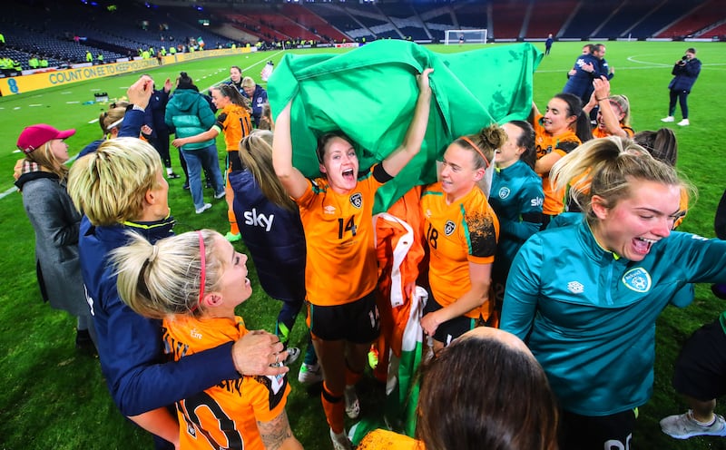 Heather Payne (number 14) celebrating with her Republic of Ireland team-mates after the 2023 World Cup qualifying play-off victory over Scotland at Hampden Park. Photograph: INPHO/Ryan Byrne