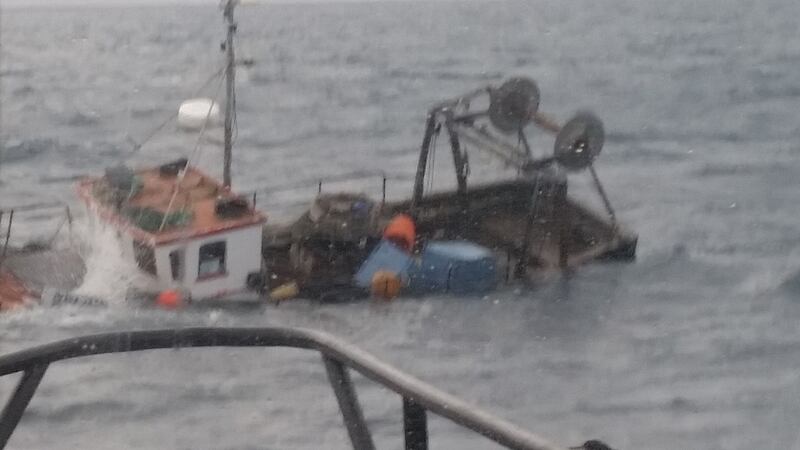 Handout photograph issued by the RNLI of a fishing boat that began sinking in the Atlantic off the coast of west Cork and led to two fisherman being rescued. Photograph: RNLI/PA