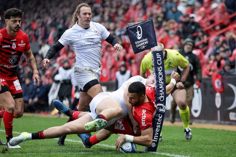 Toulouse's Matthis Lebel scores a try despite the efforts of Ulster's Stewart Moore. Photograph: Laszlo Geczo/Inpho