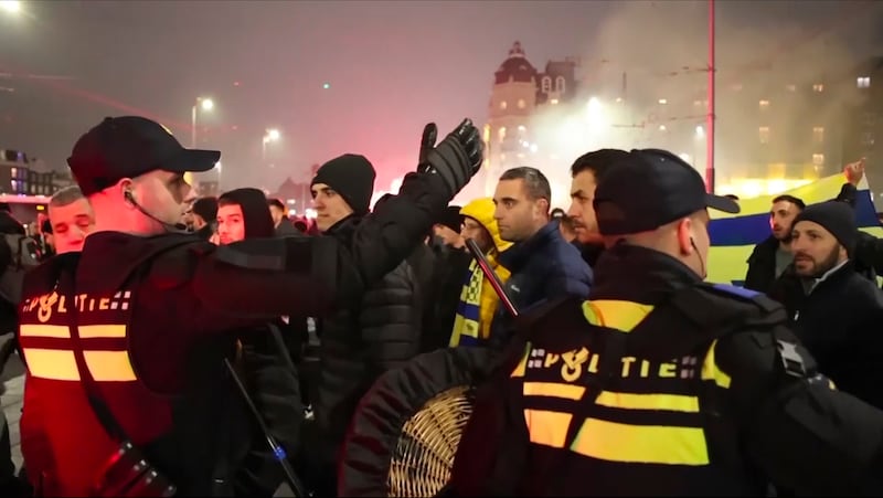 Police escort Maccabi Tel Aviv supporters to the metro station leading them to the Ajax stadium in Amsterdam. Photograph: InterVision/AP