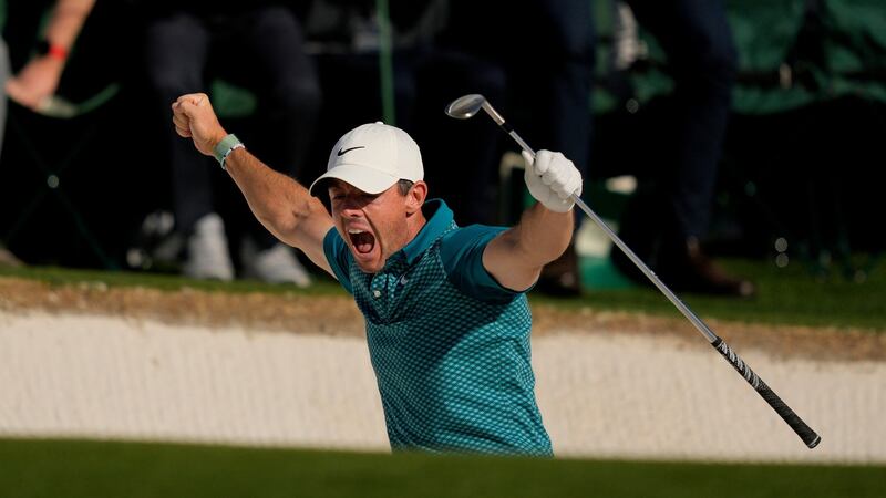 Rory McIlroy reacts after holing out from the bunker for a birdie during the final round at the Masters.  Photograph: Matt Slocum/AP Photo