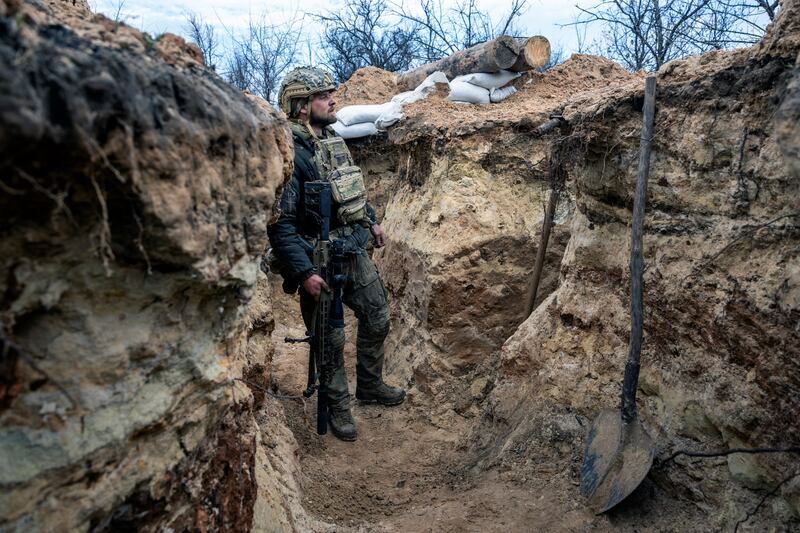 A Ukrainian sniper looks towards a Russian position from a frontline trench outside  Bakhmut on Sunday. Photograph: John Moore/Getty